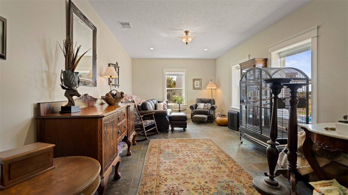 11258 Providence Road Hearne, TX 77859 - Photo 17 of 39 a living room with furniture a window and gym equipment