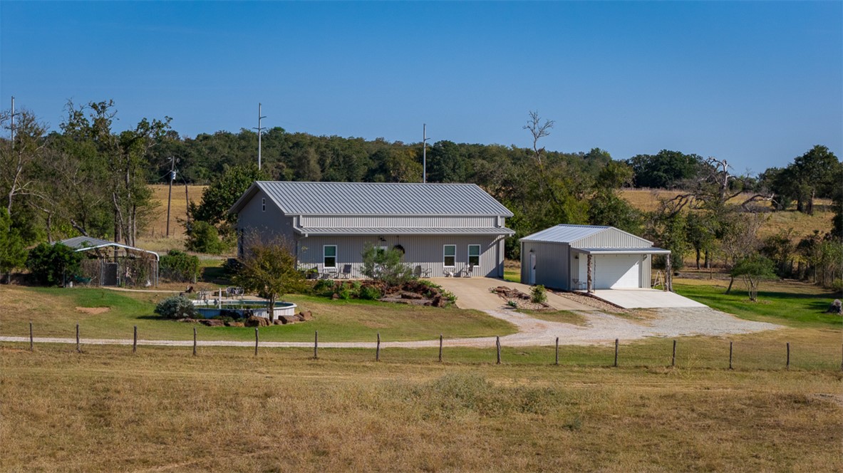 11258 Providence Road Hearne, TX 77859 - Photo 2 of 39 a view of a house with a garden and mountains