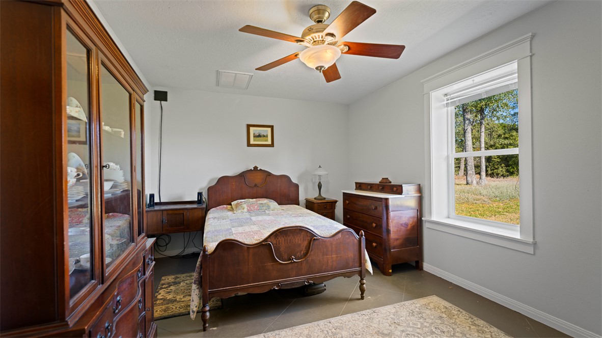 11258 Providence Road Hearne, TX 77859 - Photo 23 of 39 a bedroom with a bed and a window