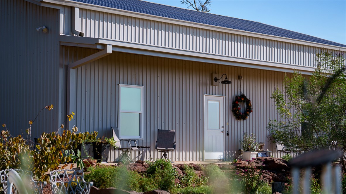 11258 Providence Road Hearne, TX 77859 - Photo 7 of 39 a front view of a house with a garden