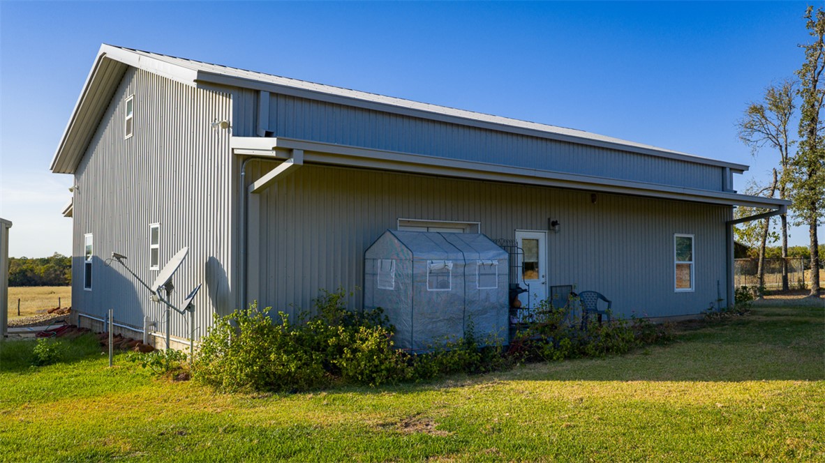 11258 Providence Road Hearne, TX 77859 - Photo 9 of 39 a front view of a house with garden