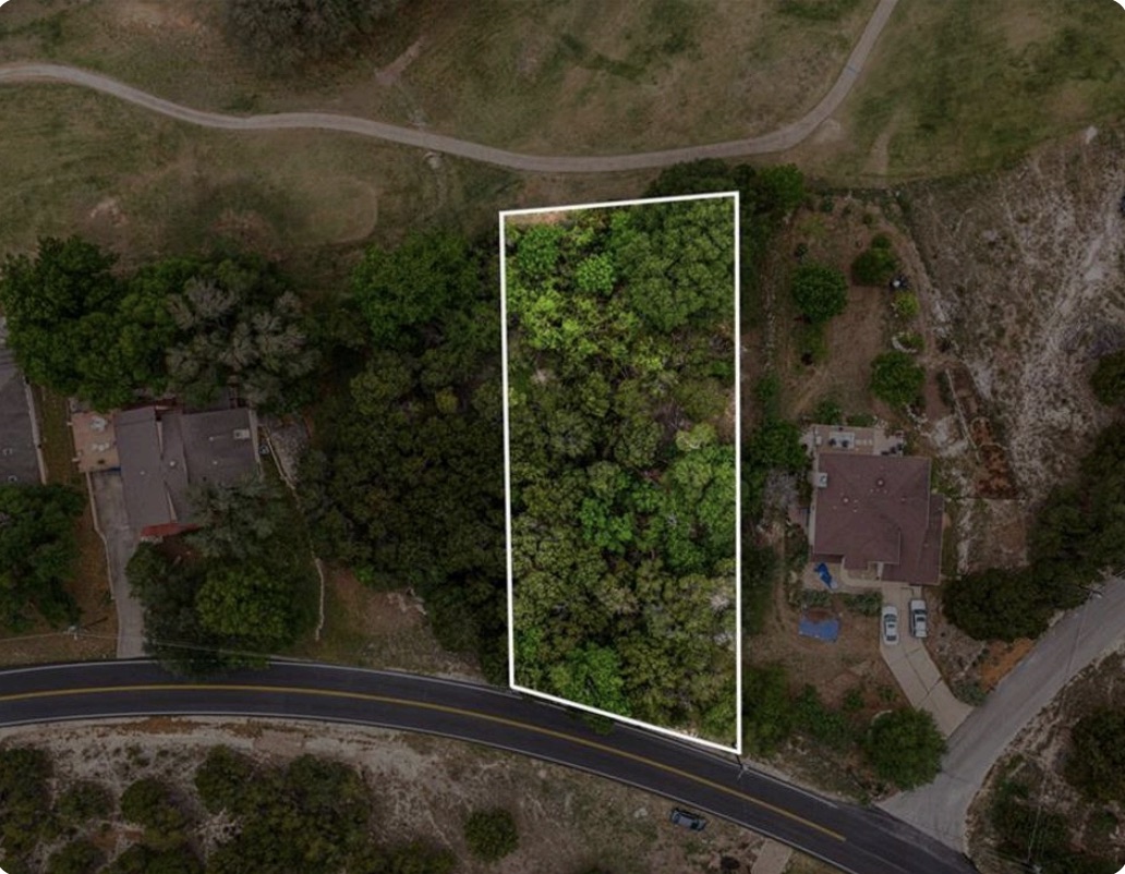 4106 Outpost Trace Lago Vista, TX 78645 - Photo 28 of 40 a view of backyard with green space