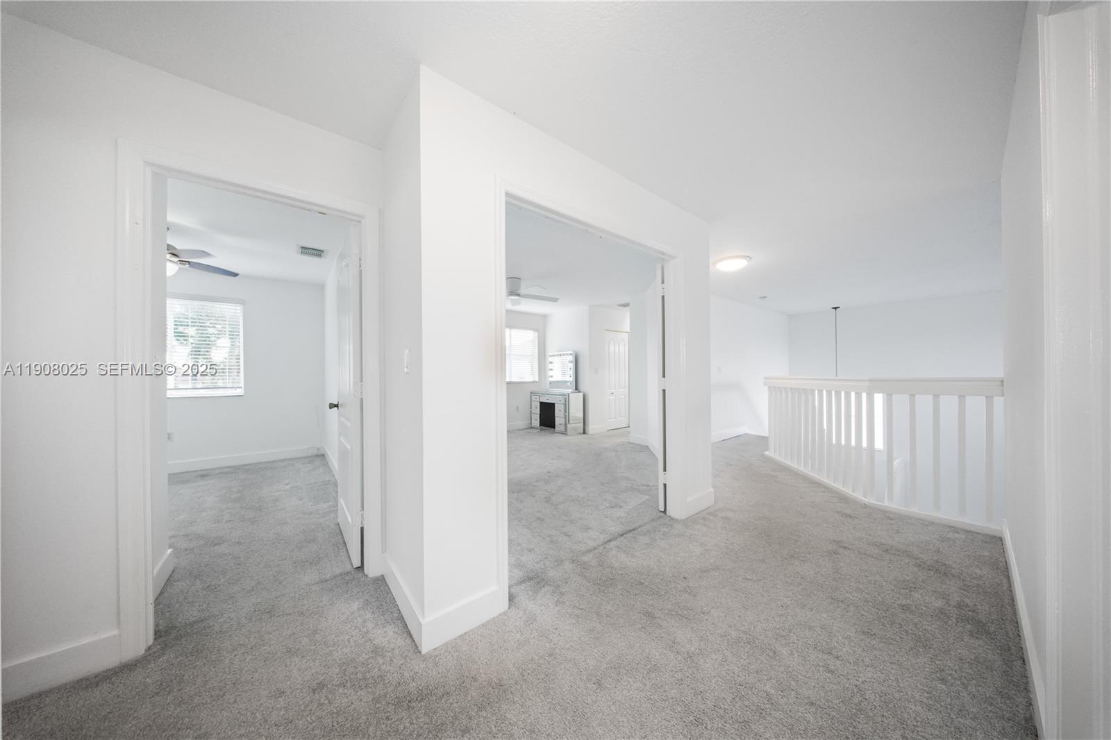 13868 Southwest 38th Terrace Miami, FL 33175 - Photo 13 of 30 an empty room with windows and entrance to other room