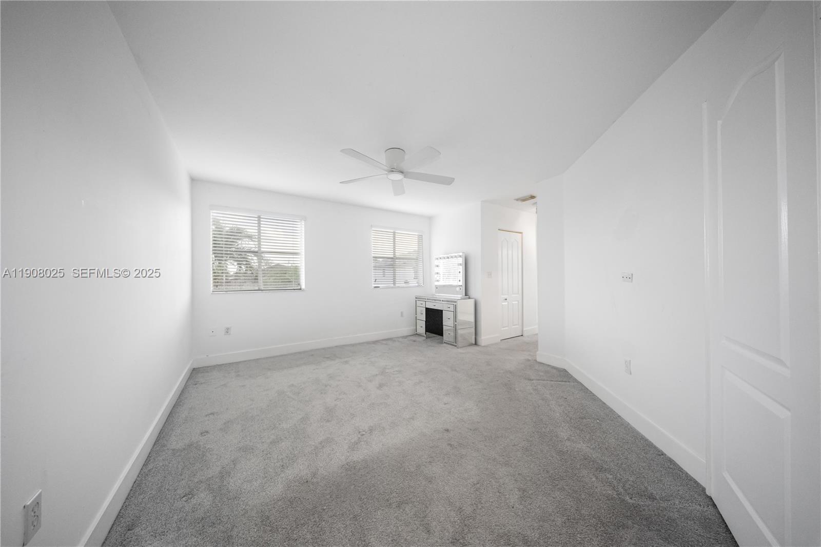 13868 Southwest 38th Terrace Miami, FL 33175 - Photo 14 of 30 an empty room with windows and closet