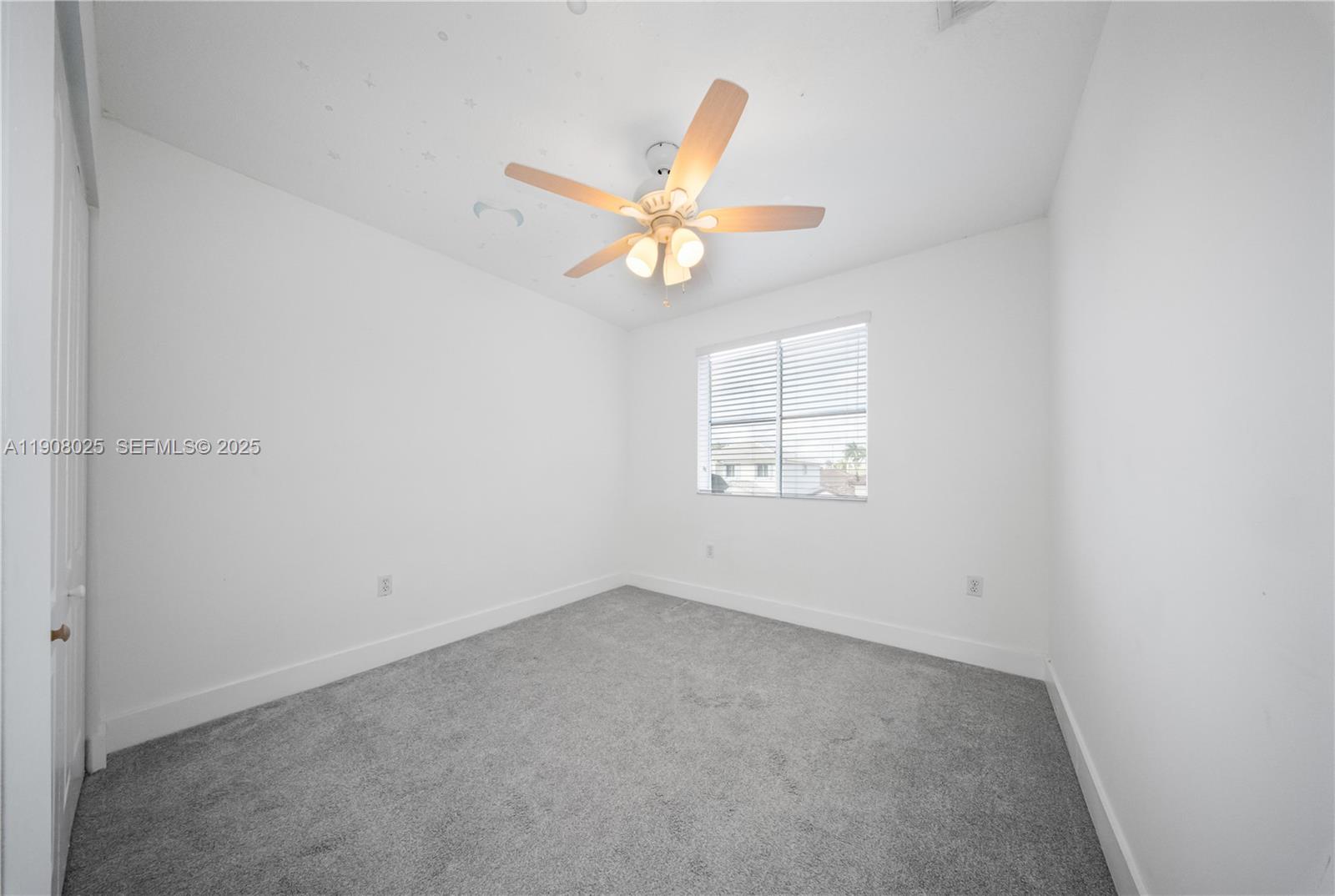 13868 Southwest 38th Terrace Miami, FL 33175 - Photo 18 of 30 an empty room with windows and fan