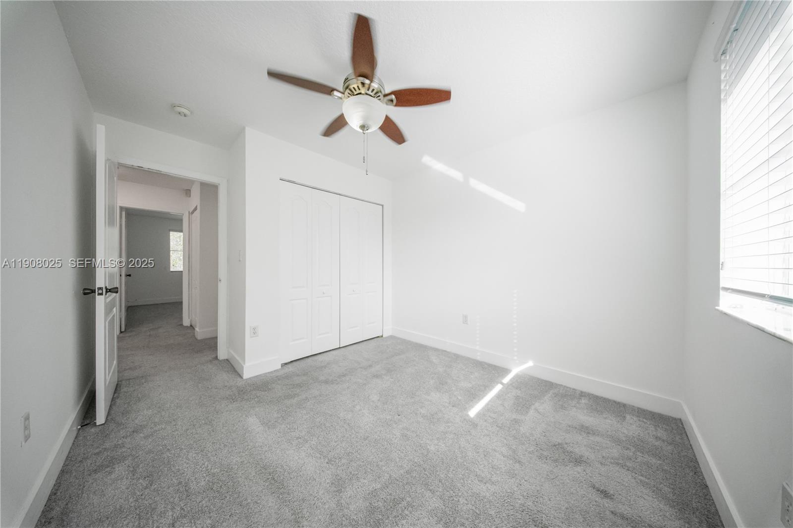 13868 Southwest 38th Terrace Miami, FL 33175 - Photo 23 of 30 an empty room with windows and entrance