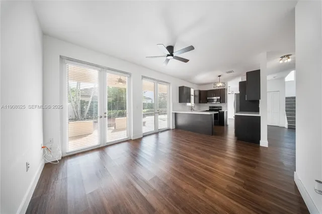 a view of a kitchen with a stove cabinets and a wooden floor