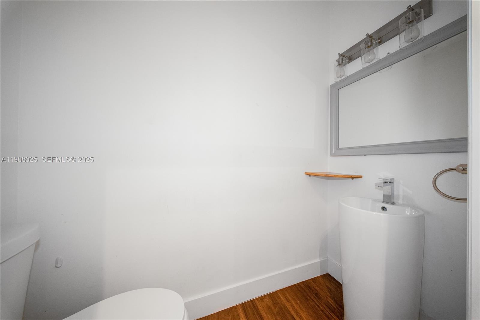 13868 Southwest 38th Terrace Miami, FL 33175 - Photo 9 of 30 a bathroom with a toilet and a sink