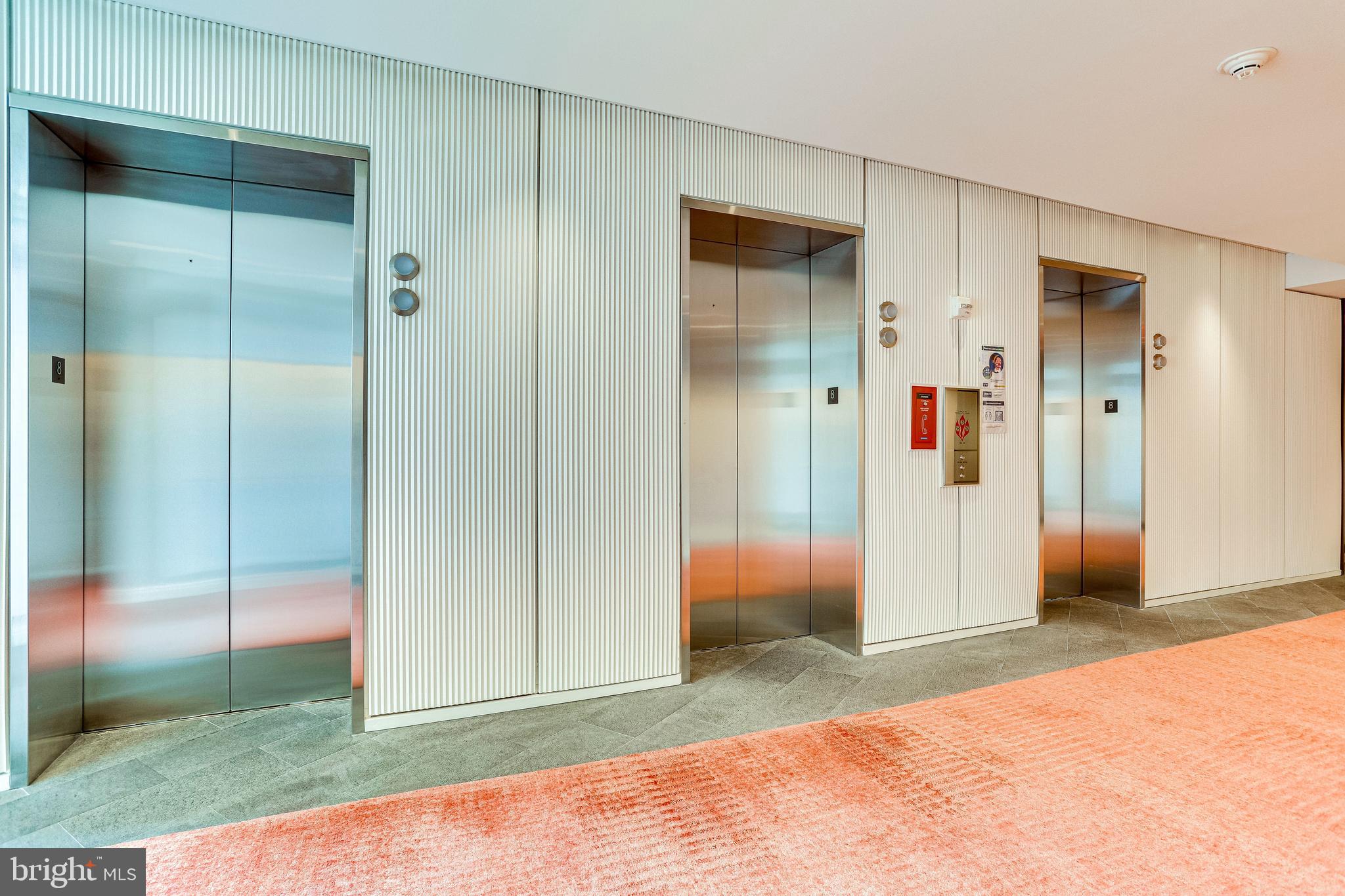 1177 22nd Street Northwest, Unit 8J Washington, DC 20037 - Photo 4 of 23 Elevator banks