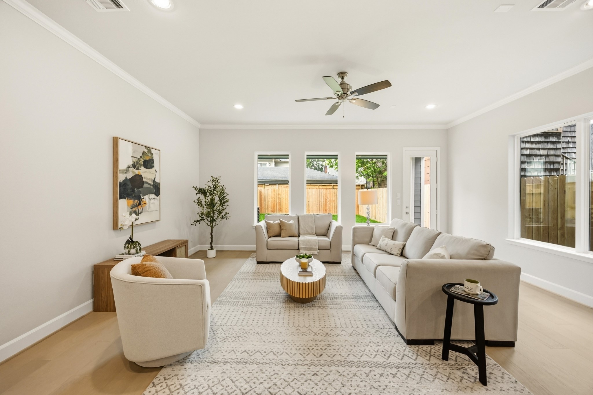 4317 Roseland Street, Unit B Houston, TX 77006 - Photo 8 of 29 Bask in the warmth of the living room, where neutral light walls and exquisite light wood floors craft an ambiance of understated elegance.