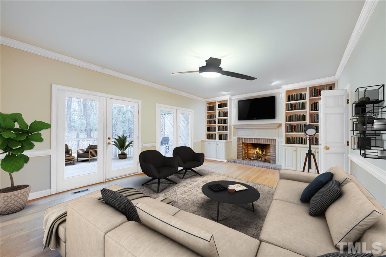 7804 Sandy Bottom Way Raleigh, NC 27613 - Photo 14 of 30 a living room with furniture fireplace and flat screen tv