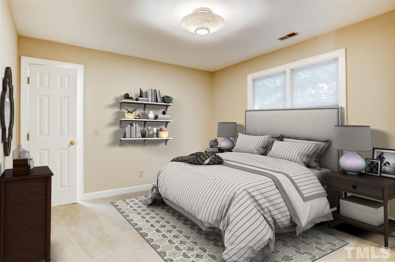 7804 Sandy Bottom Way Raleigh, NC 27613 - Photo 22 of 30 a bedroom with a bed and a painting on the wall
