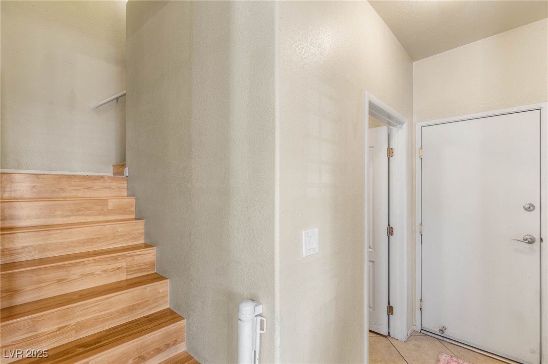 1591 Rusty Ridge Lane Henderson, NV 89002 - Photo 14 of 27 Stairway featuring tile patterned flooring