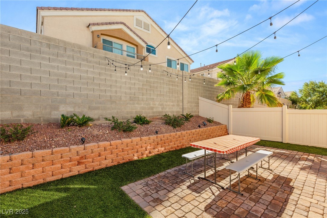 1591 Rusty Ridge Lane Henderson, NV 89002 - Photo 24 of 27 Fenced backyard with a patio area