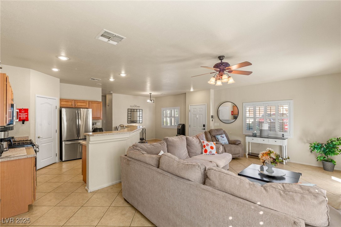 1591 Rusty Ridge Lane Henderson, NV 89002 - Photo 7 of 27 Living area floors, a ceiling fan, healthy amount of natural light, and recessed lighting