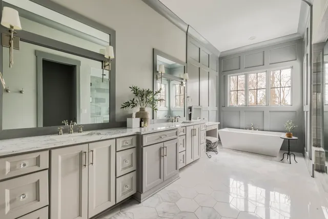 a living room with furniture a flat screen tv and wooden floor