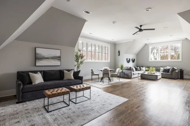 a bedroom with bed and a large window