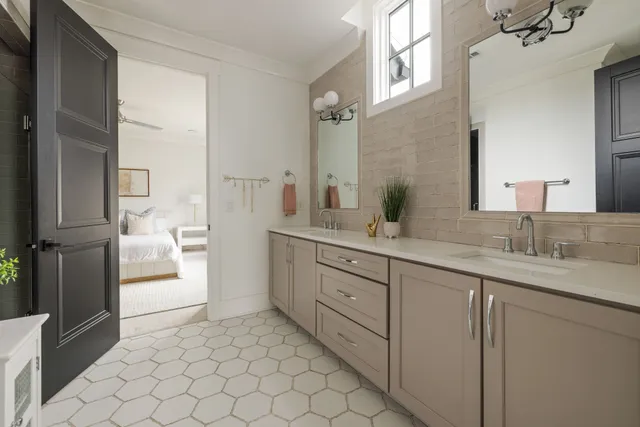 a bedroom with a bed table and window