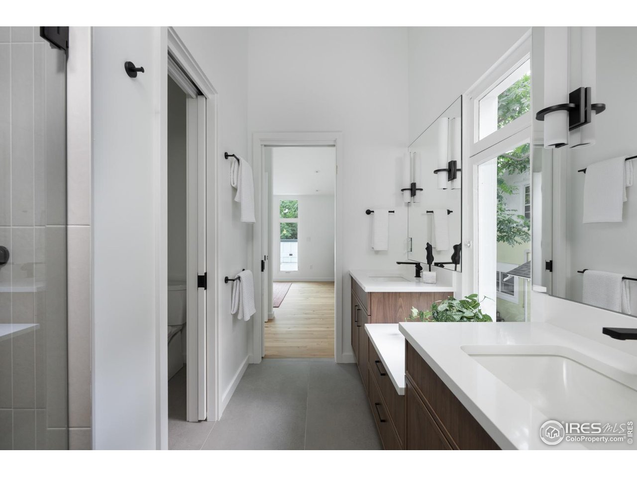 934 Spruce Street Boulder, CO 80302 - Photo 27 of 49 Private water closet and glass walk-in shower for primary suite.