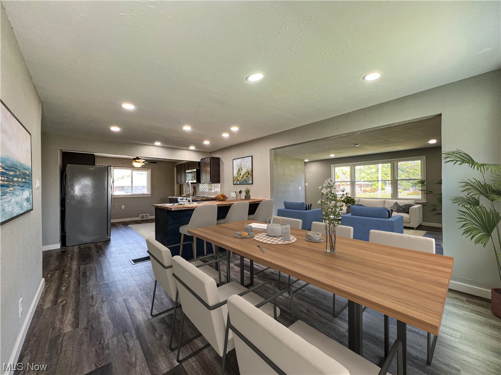 602 West Marshall Road McDonald, OH 44437 - Photo 4 of 19 Staged-LVP floored dining area featuring a textured ceiling, sink, and ceiling fan