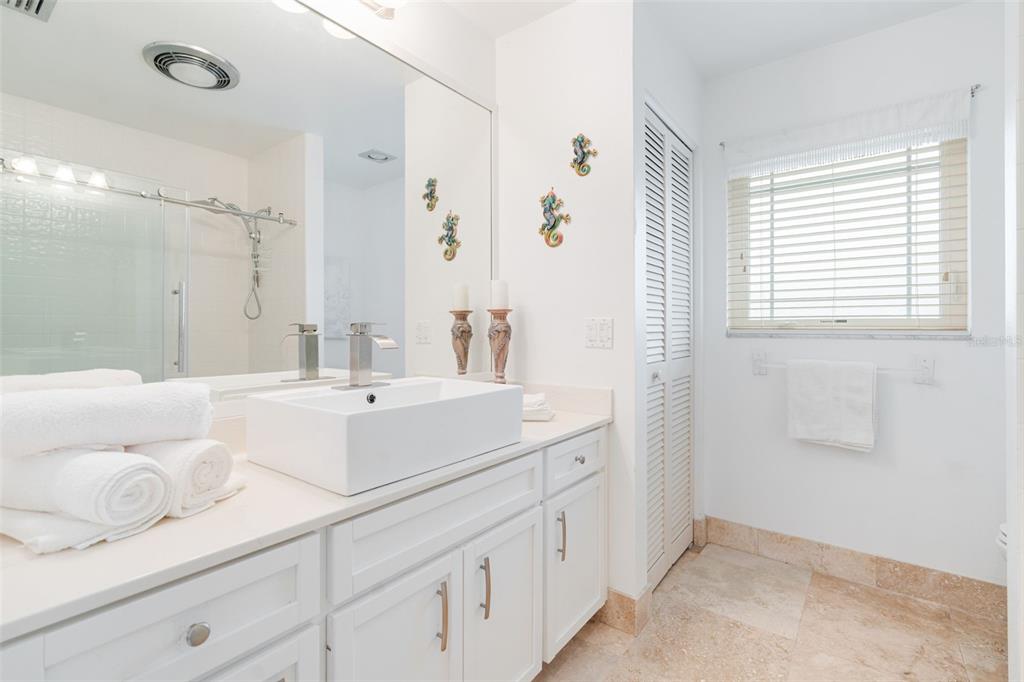 402 Devonshire Lane Venice, FL 34293 - Photo 15 of 52 a bathroom with a sink and a mirror