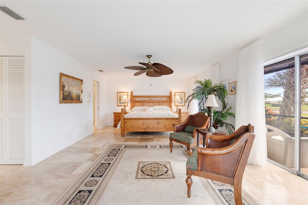 402 Devonshire Lane Venice, FL 34293 - Photo 19 of 52 a living room with furniture and a potted plant