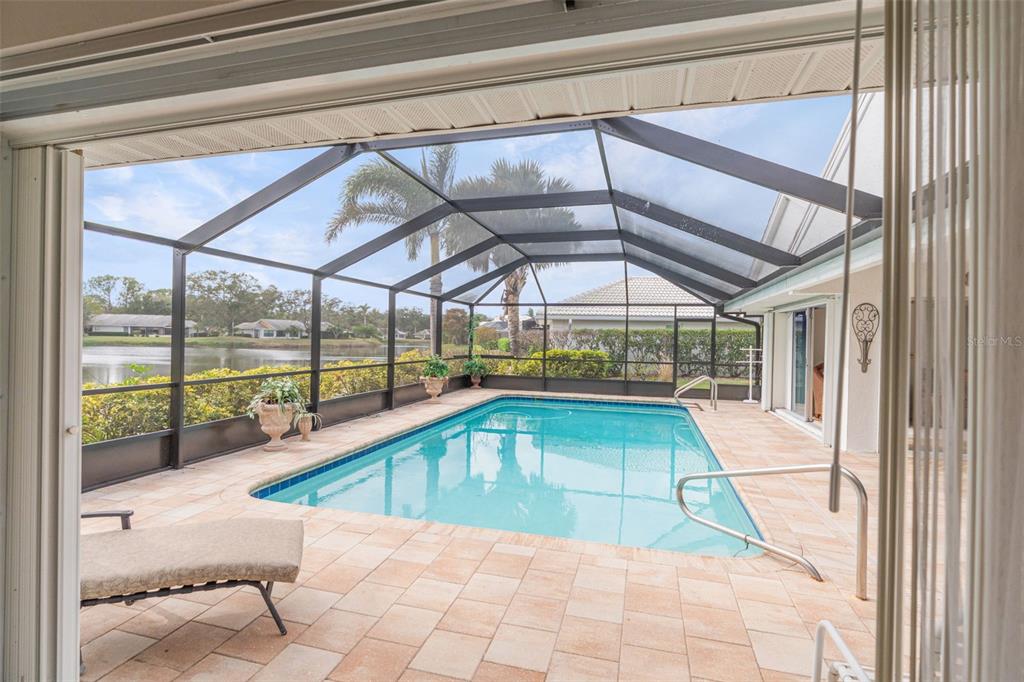 402 Devonshire Lane Venice, FL 34293 - Photo 20 of 52 a view of a swimming pool with a yard