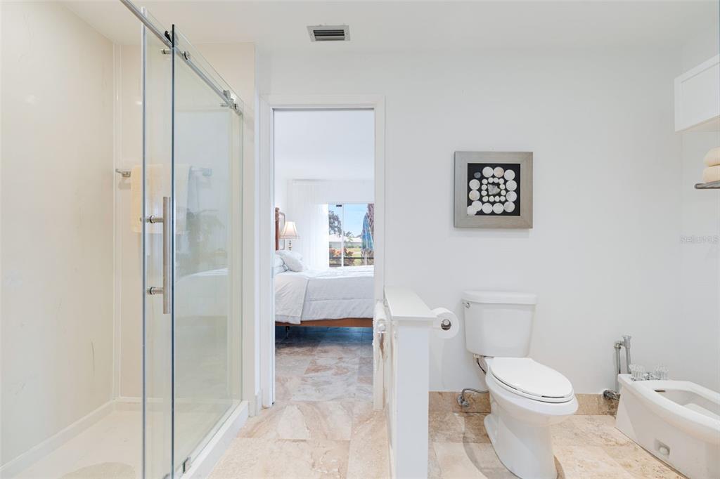 402 Devonshire Lane Venice, FL 34293 - Photo 24 of 52 a white toilet sitting next to a bathroom sink