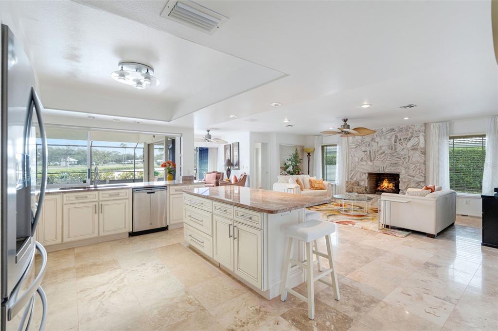 402 Devonshire Lane Venice, FL 34293 - Photo 28 of 52 a large white kitchen with a large window