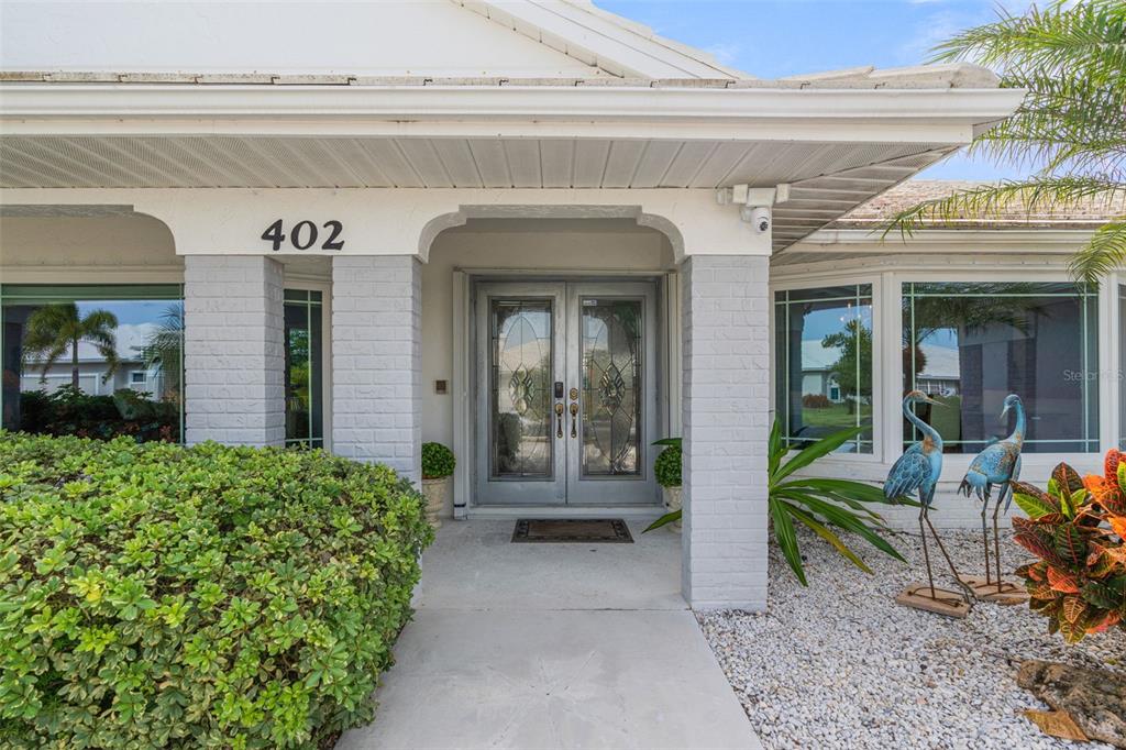 402 Devonshire Lane Venice, FL 34293 - Photo 3 of 52 a view of a entryway door of the house