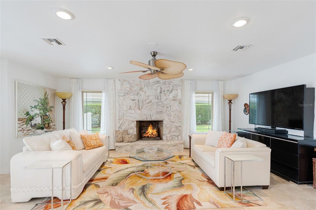 402 Devonshire Lane Venice, FL 34293 - Photo 32 of 52 a living room with furniture and a flat screen tv