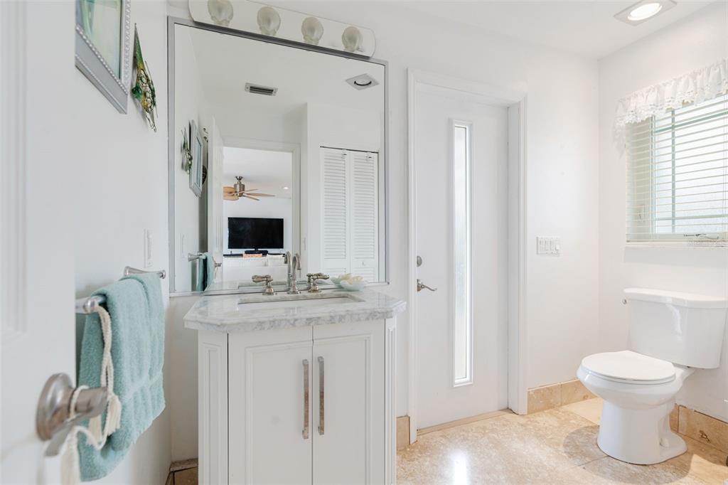 402 Devonshire Lane Venice, FL 34293 - Photo 36 of 52 a bathroom with a toilet sink and mirror