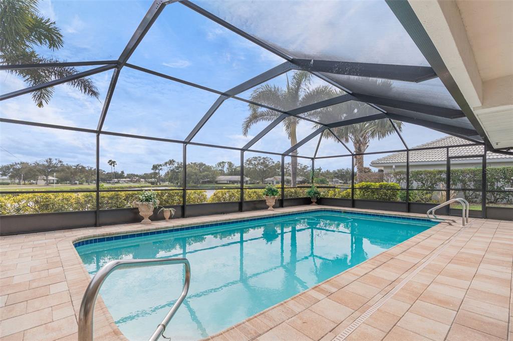402 Devonshire Lane Venice, FL 34293 - Photo 38 of 52 a view of a swimming pool with a porch