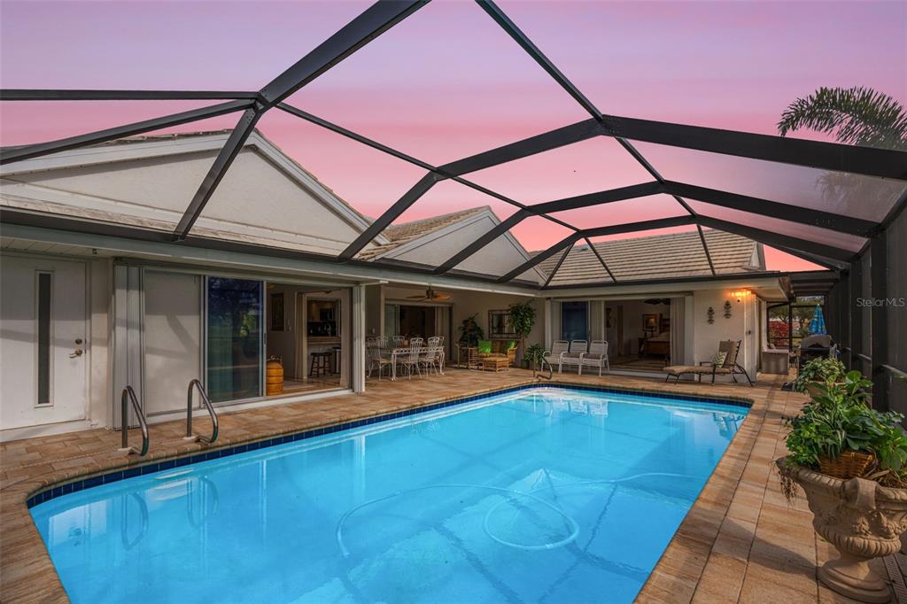 402 Devonshire Lane Venice, FL 34293 - Photo 40 of 52 a view of a house with pool and sitting area