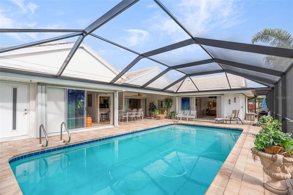 402 Devonshire Lane Venice, FL 34293 - Photo 41 of 52 a view of a house with pool table and chairs