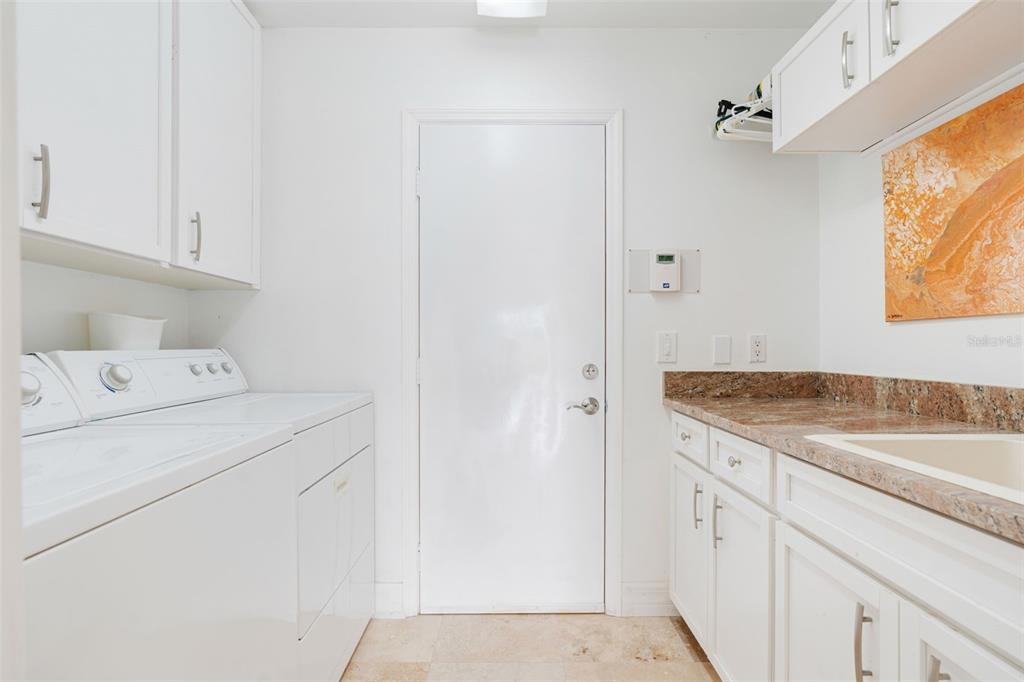 402 Devonshire Lane Venice, FL 34293 - Photo 42 of 52 a utility room with dryer and washer