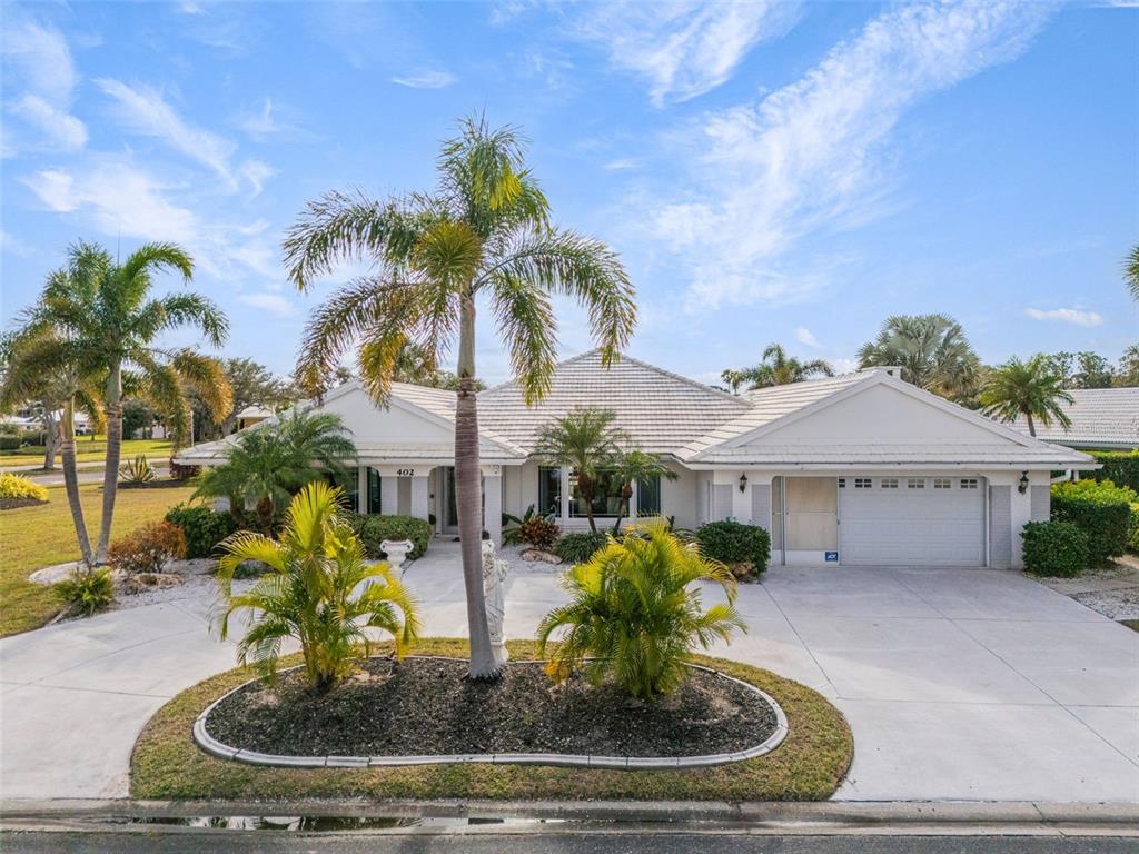 402 Devonshire Lane Venice, FL 34293 - Photo 46 of 52 a house view with a garden space