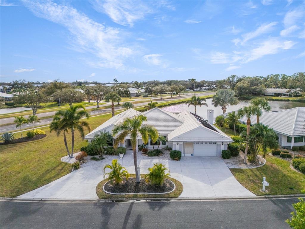 402 Devonshire Lane Venice, FL 34293 - Photo 47 of 52 a view of a lake with couches and city view