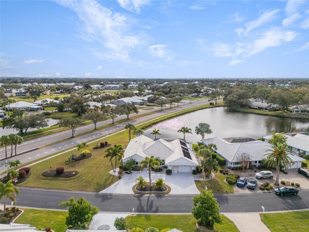 402 Devonshire Lane Venice, FL 34293 - Photo 48 of 52 a view of a lake with a city