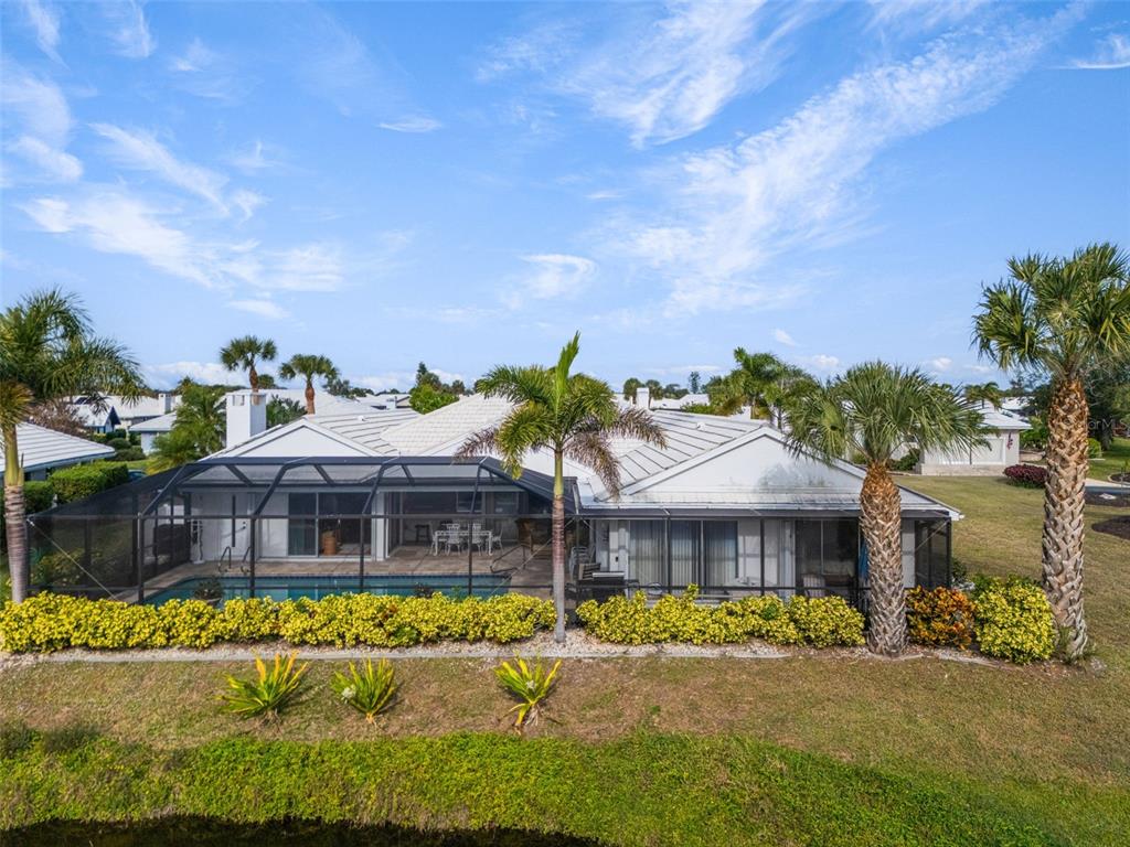 402 Devonshire Lane Venice, FL 34293 - Photo 52 of 52 a front view of a house with a garden