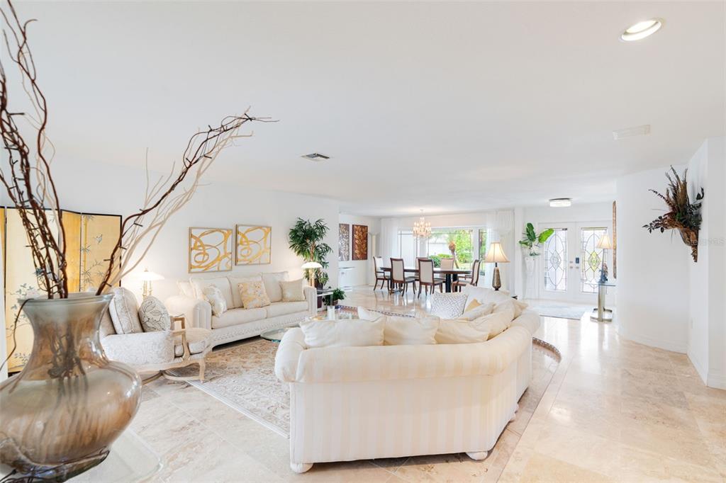 402 Devonshire Lane Venice, FL 34293 - Photo 8 of 52 a living room with furniture and a table