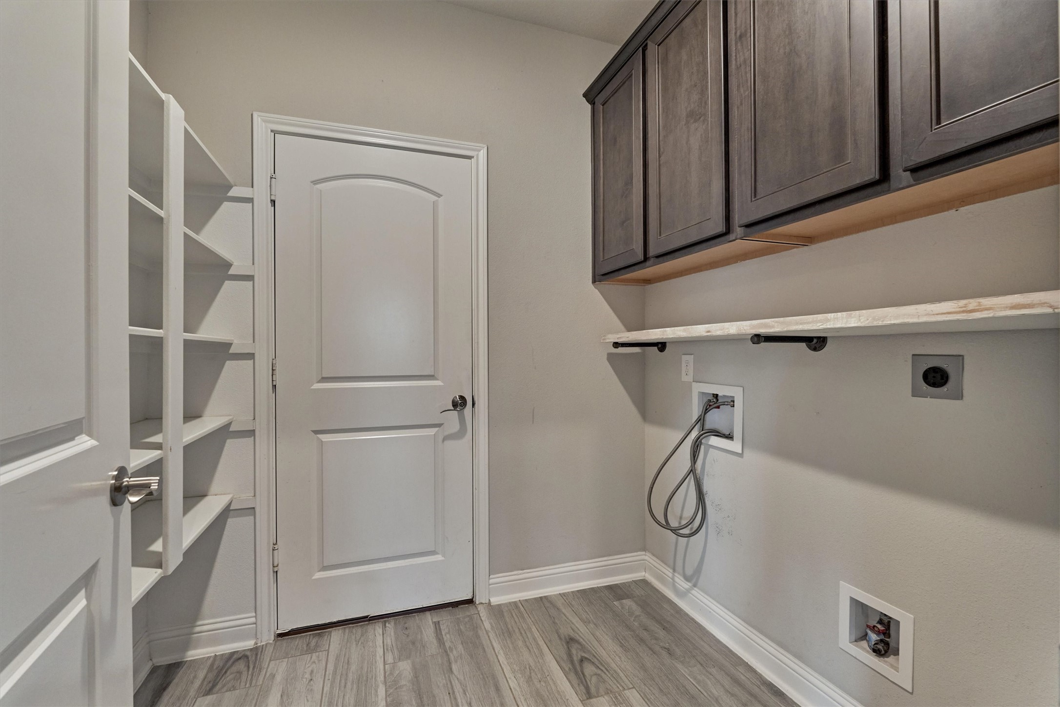 180 Racetrack Lane Montgomery, TX 77356 - Photo 30 of 46 Laundry room with stoage and access to the garage.