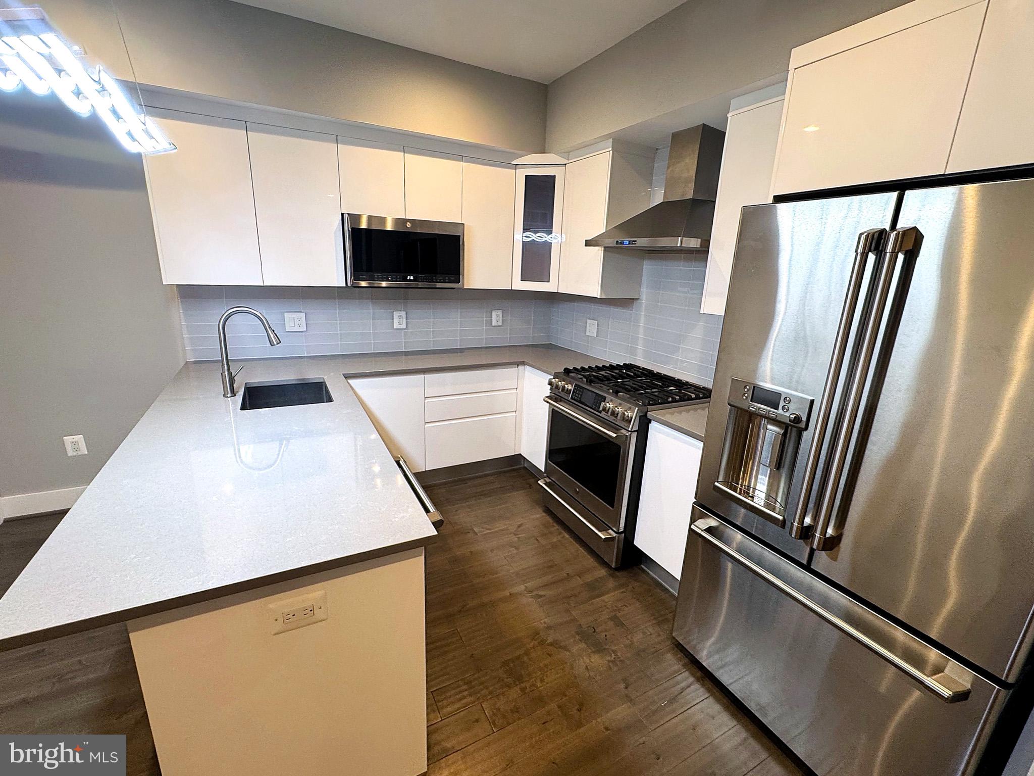 625 Park Road Northwest Washington, DC 20010 - Photo 5 of 22 Sleek modern kitchen with elegance.