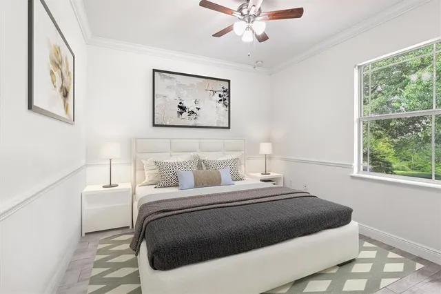 a bedroom with bed and a window