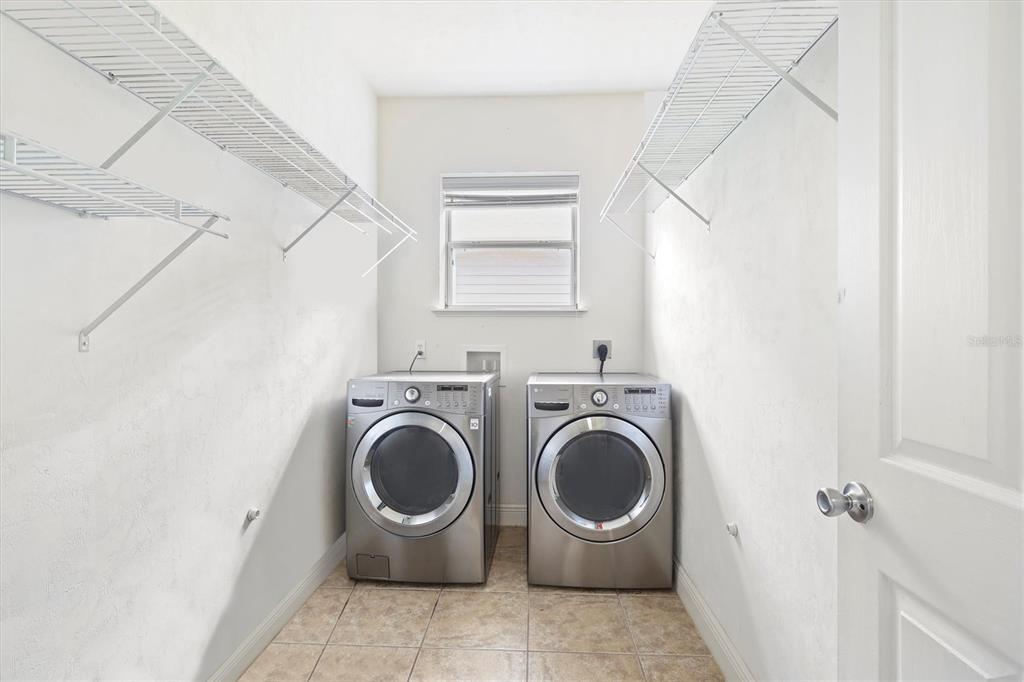 7909 Southwest 87th Terrace Gainesville, FL 32608 - Photo 16 of 17 a utility room with dryer and washer