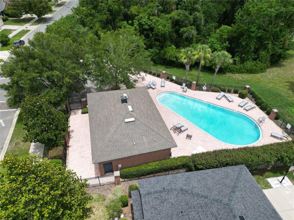 7909 Southwest 87th Terrace Gainesville, FL 32608 - Photo 2 of 17 an aerial view of a house with a garden and a yard