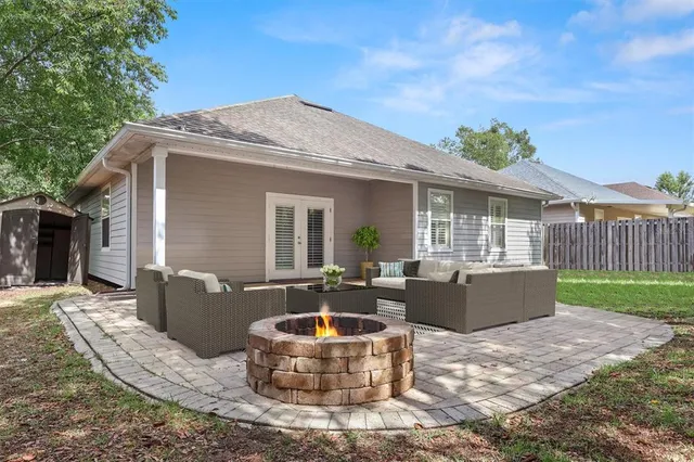 a front view of house with yard outdoor seating and barbeque oven