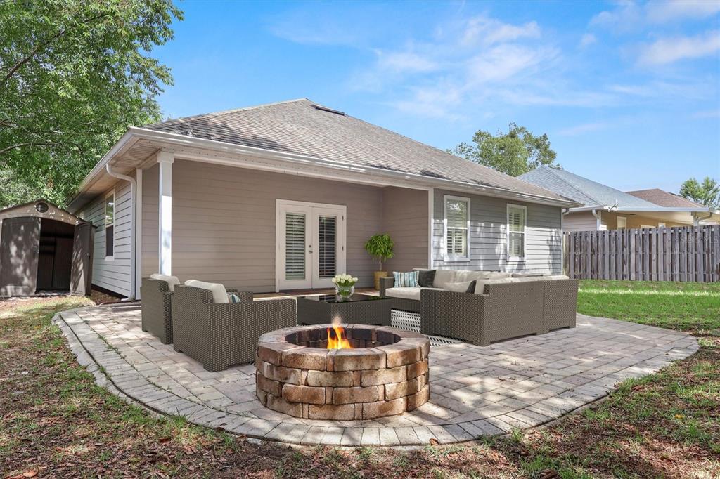 7909 Southwest 87th Terrace Gainesville, FL 32608 - Photo 4 of 17 a front view of house with yard outdoor seating and barbeque oven