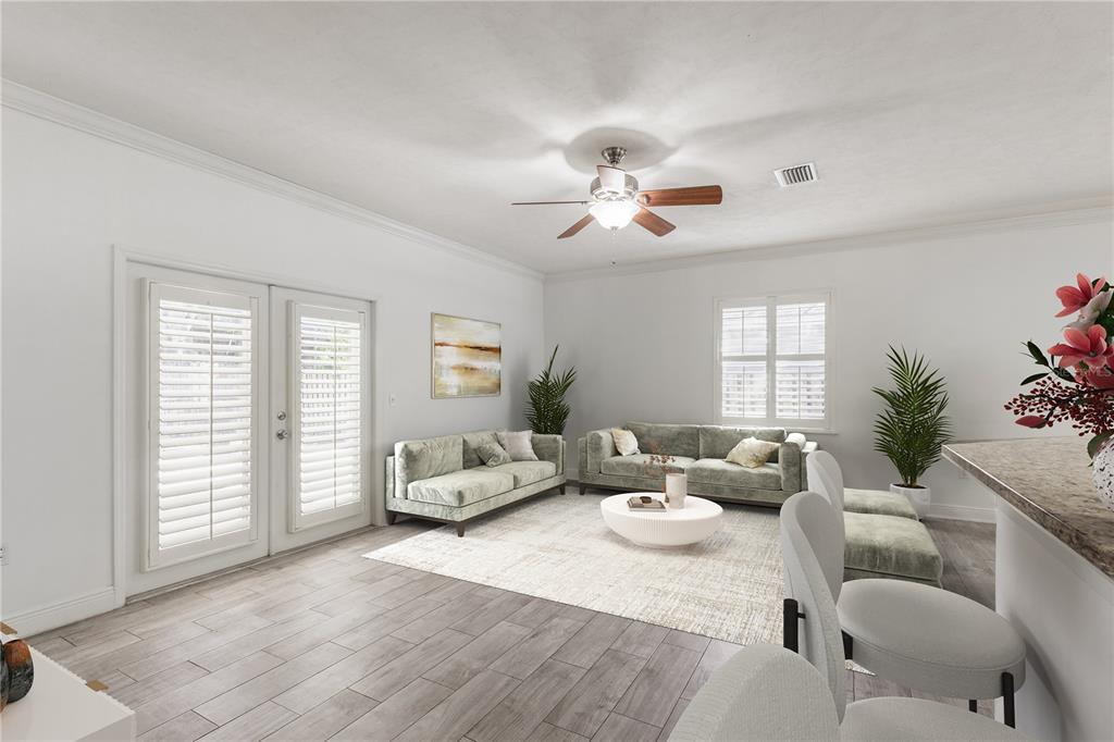 7909 Southwest 87th Terrace Gainesville, FL 32608 - Photo 10 of 17 a living room with furniture flowerpot and a window