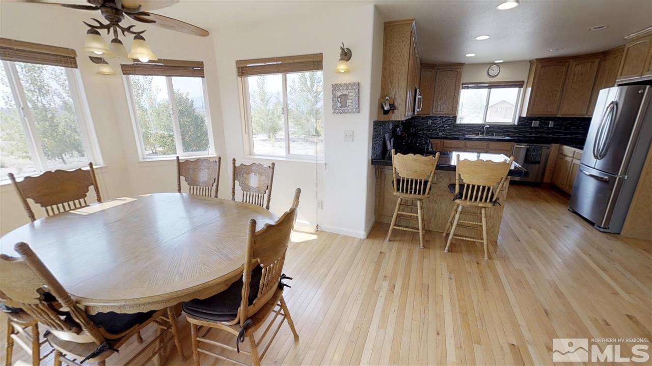 6080 Range Reno, NV 89510 - Photo 6 of 33 a view of a dining room with furniture window and wooden floor